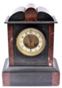 A 19th Century slate and marble mantle clock. 8 day movement striking on a gong. With pendulum.