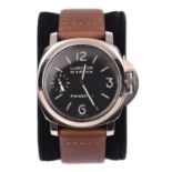 A Panerai Luminor Marina watch with stainless steel case simple black face and white arabic