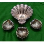 4x silver scallop dishes. A larger example hallmarked Sheffield 1978, 'JNL'. Together with a set
