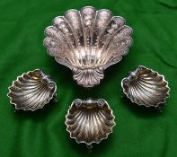 4x silver scallop dishes. A larger example hallmarked Sheffield 1978, 'JNL'. Together with a set