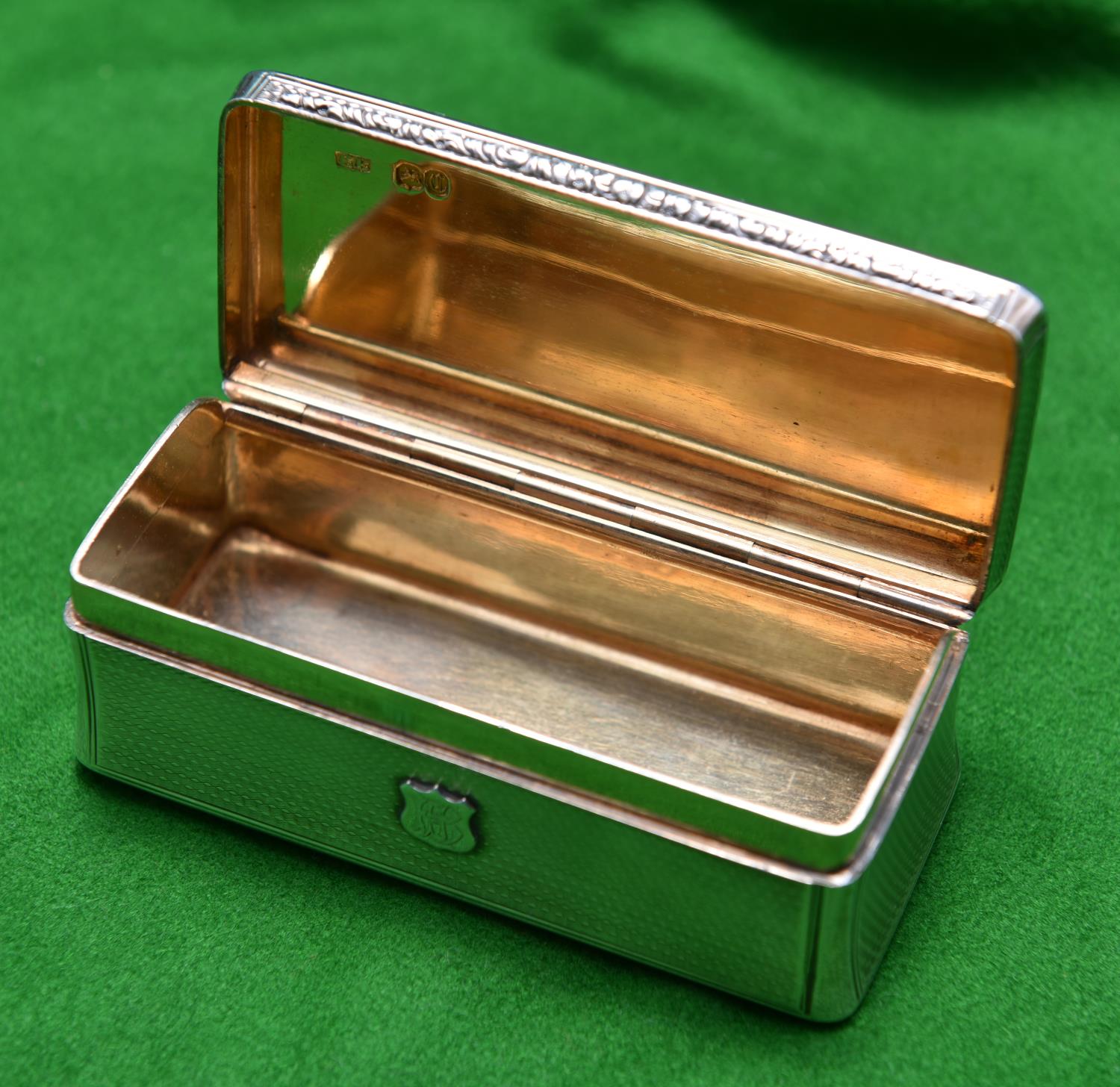 A silver trinket box with gilt wash interior. Monogrammed 'CB' to lid and 'BH' to front.