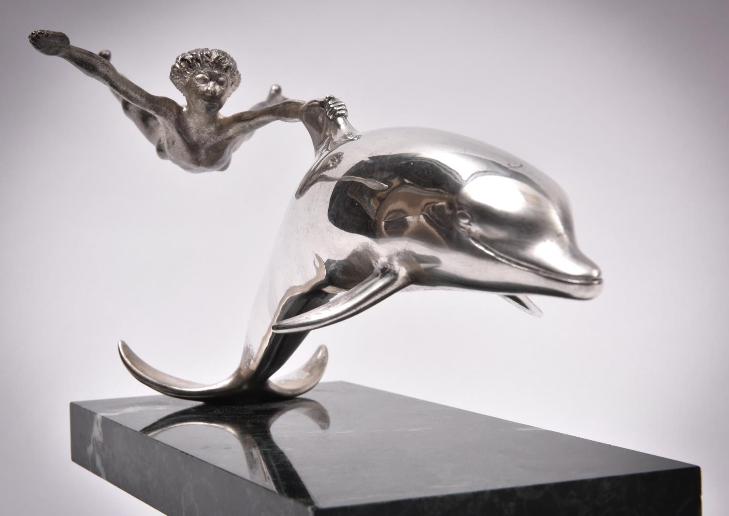 A silver sculpture 'Boy With A Dolphin', London 1979 by David Wynne for Mappin and Webb. A