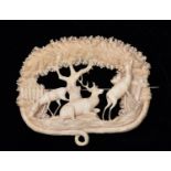 A very finely worked 19th Century Victorian ivory brooch depicting a very detailed scene with