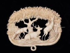 A very finely worked 19th Century Victorian ivory brooch depicting a very detailed scene with