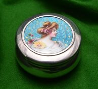A silver round pot with removable lid and gilt washed interior. Engine turned enamel lid with a