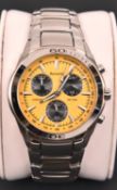 An Accurist MB882Y JS00 Chronograph watch with quartz movement. Metallic yellow face with three