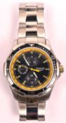 An Accurist MB785 GP10 watch with quartz movement. Metallic black and yellow face with three