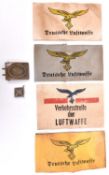 A Third Reich Luftwaffe OR’s belt buckle, 4 different printed Luftwaffe armbands and a day badge. GC