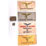 A Third Reich Luftwaffe OR’s belt buckle, 4 different printed Luftwaffe armbands and a day badge. GC