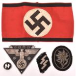 A Third Reich red, white and black armband, also an SS circular enamel badge, an Edelweiss badge;