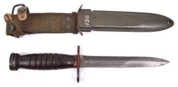 A WWII US M4 bayonet for the M1/M1A1 carbine, by Utica, in its US M8A1 sheath by Victory Plastics.