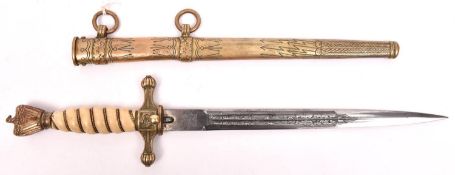 A Third Reich Naval officer’s dagger, the blade etched with entwined dolphins and fouled anchors,