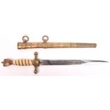 A Third Reich Naval officer’s dagger, the blade etched with entwined dolphins and fouled anchors,