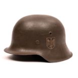 A Third Reich M42 single decal steel helmet, the skull with rough dark grey finish and eagle