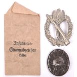 A Third Reich Infantry Assault badge, silver alloy finish, with its issue envelope and a black wound