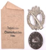 A Third Reich Infantry Assault badge, silver alloy finish, with its issue envelope and a black wound