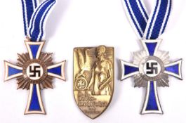 2 Third Reich Mother’s Crosses, 1 silver, 1 bronze, both enamelled and with ribbons; also a party