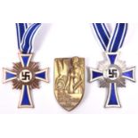 2 Third Reich Mother’s Crosses, 1 silver, 1 bronze, both enamelled and with ribbons; also a party