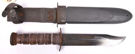 A WWII US Navy Mk 2 fighting knife, by RCC (Robertson Cutlery Co), with blackened blade, in its