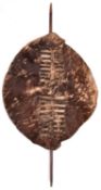 A rare Swazi cowhide fighting shield of Zulu War period, brown in colour, 28" x 22½”, complete