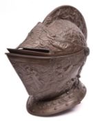 A good old cast iron copy of a late 16th century close helmet, with two piece hinged vizor, finely