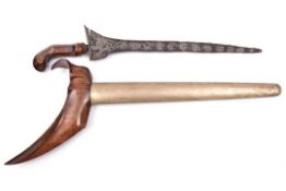 A Malay kris, straight thin blade 12½” with deeply etched pamor pattern, the stained wood hilt