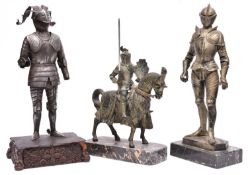 A silvered spelter figure of a standing knight in 16th century style full armour, the base marked “