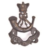 A Vic Queen’s County Rifles OR’s glengarry badge, bronzed finish. GC £40-50