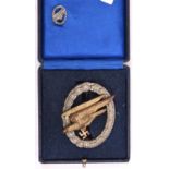 A Third Reich Army Parachutist’s badge, gilt eagle WM wreath, with a tiepin, in issue case. GC £