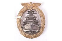 A Third Reich High Seas Fleet badge, with gilt washed wreath and silver/grey centre, the unmarked