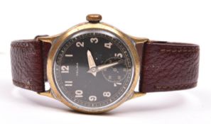 Helma wristwatch. Plated case with brushed finish, heavy wear, most plating missing. Fixed bars.