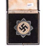 A Third Reich German Cross in gold, in silver, gilt, bronze and enamel finish, pin stamped “1” in