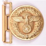 A Third Reich NSDAP Political Leader’s gold anodised aluminium belt buckle, the reverse embossed