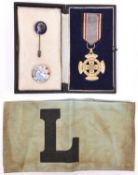 A Third Reich R.L.B. Cross of Bravery, with ribbon and in case of issue; 2 other R.L.B. badges and a