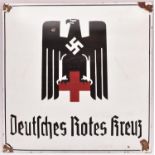 A black and red on white enamelled sign, bearing Third Reich Red Cross eagle above “Deutsches