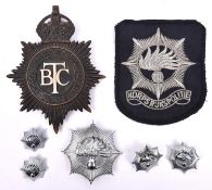 A pre 1952 British Transport Commission Police helmet plate; also a pre 1993 Netherlands National