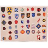 35 US Army Air Force and related cloth patches, mounted on a card; and 43 US Army Division patches