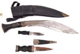 A modern kukri, with horn hilt and leather covered sheath, GC; a costume skean dhu, with plastic