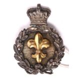 An unusual Vic small glengarry or shako badge, consisting of a silver laurel wreath surmounted by