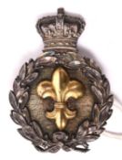An unusual Vic small glengarry or shako badge, consisting of a silver laurel wreath surmounted by