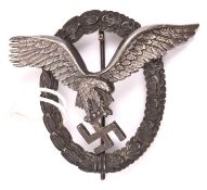 A Third Reich Pilot’s badge, silvered finish eagle with bronzed wreath. VGC £100-120