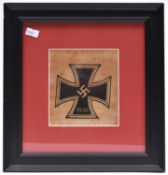 A section of silk with a 1939 Iron Cross woven, probably part of a car pennant, in an ebonised frame