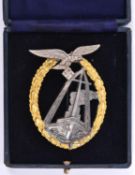 A Third Reich Luftwaffe Sea Battle badge, gilt wreath, silvered eagle and gun metal ship, marked