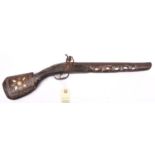 A decorative Indian bazaar “flintlock” pistol, 21½” overall, with wire and M.O.P. inlaid stock and