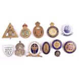 8 enamelled lapel badges and brooches: Nat Reserve London “II”, the back stamped “CAMBERWELL”;