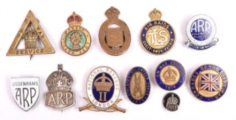 8 enamelled lapel badges and brooches: Nat Reserve London “II”, the back stamped “CAMBERWELL”;