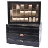 4 display/storage cases for watches, each with 24 compartments, some containing shaped pads to