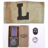 A Third Reich Luftschutz medal, with ribbon, in case of issue; 2 other Luftschutz badges, and a