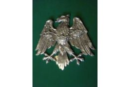 A polished cast aluminium heraldic spread eagle, with 3 crowns on its breast and wings, as used by