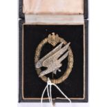 A Third Reich Army Parachutists breast badge, silvered eagle with gilt wreath, marked on reverse “